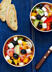 Greek salad with feta cheese, olives and vegetables