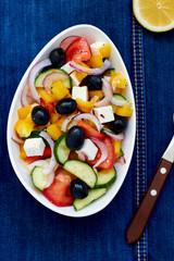 Greek salad with feta cheese, olives and vegetables
