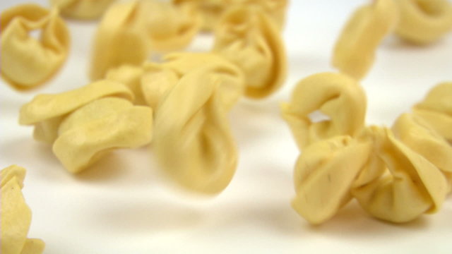 tortelli pasta falling and filling the screen in slow motion
