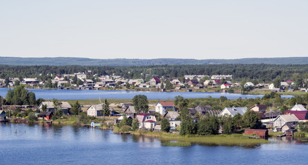 Fototapeta na wymiar Private houses of suburbs on a lake