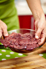 Woman holding chicken liver