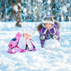 sisters in the winter forest