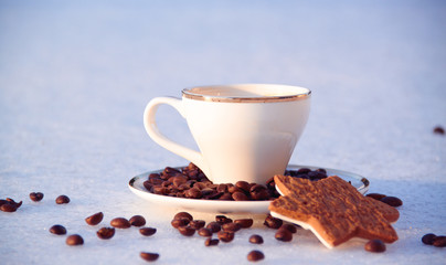 warm cup of coffee outdoors in the snowy scene