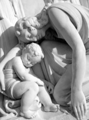 mother mourning her child - sculpture on monumental cemetery