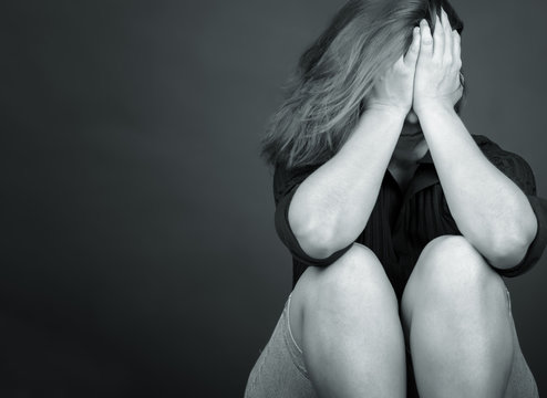 Black And White Portrait Of A Sad And Lonely Woman Crying