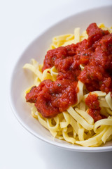 bowl of pasta with tomatoe sauce