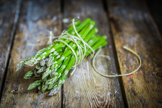 Asparagus on rustic wooden background
