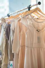 Dresses on a wooden hangers