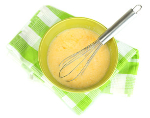 Corolla and broken eggs in bowl isolated on white