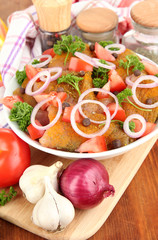 Turkey meat in bowl on wooden table close up