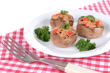 Stuffed mushrooms on plate on table close-up