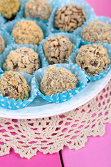 Set of chocolate candies, on wooden background