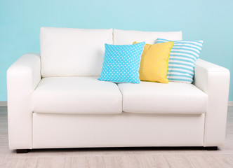 White sofa in room on blue background
