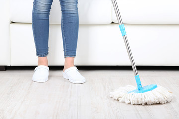 Cleaning floor in room close-up