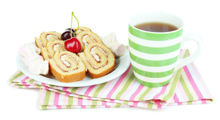 Cup of tea and sweets isolated on white