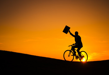 Businessman on a Bike at Sunset