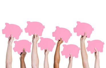 Multi-Ethnic Group Holding Piggy Bank