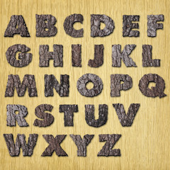 Oak  bark alphabet on wood - upper case