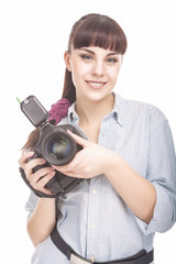 Female Photographer Holding a Professional Camera and Smiling