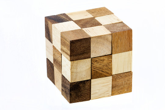 Puzzle in the form of wooden blocks on a white background