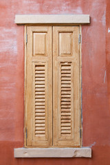 Window of old wooden house wall