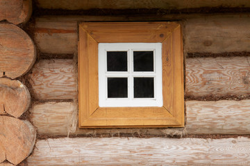 Obraz na płótnie Canvas Small window of rural wood house