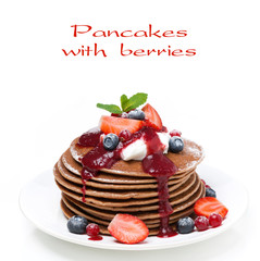 pancakes with cream and berries, close-up, isolated