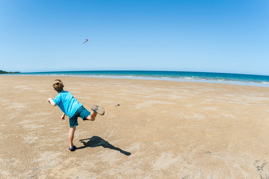 Boy Throwing Boomerang Beach Blue