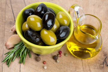 green and black olives in a green oil