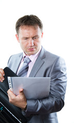 Portrait of a handsome young  businessman in suit isolated