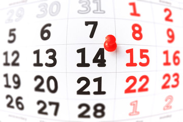 Calendar and red pushpin on 14 February. Valentine's day