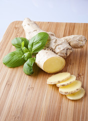Ginger root sliced on wooden table