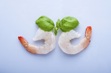 Two unshelled tiger shrimps isolated on white