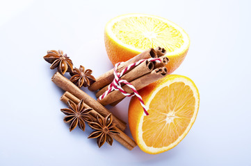 Orange fruit segment, cinnamon sticks and mint isolated on white