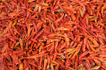 Fototapeta premium Many red roasted chillis for sale in market
