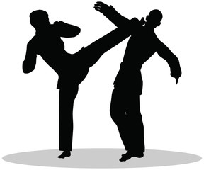 silhouettes of man and woman in karate poses