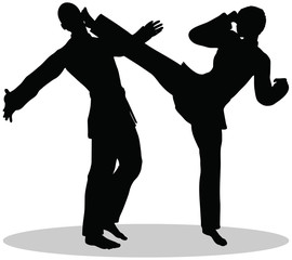 silhouettes of man and woman in karate poses