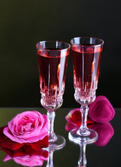 Composition with pink  wine in glasses and  roses