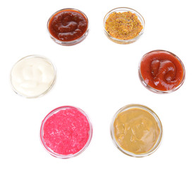 Various sauces isolated on white