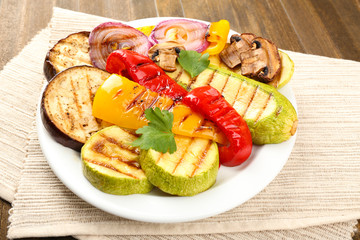 Delicious grilled vegetables on plate on table close-up