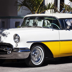Old white and yellow car