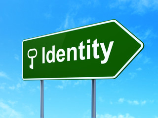 Security concept: Identity and Key on road sign background