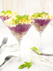 Beetroot salad with herring in a glass