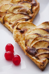 Two Valentine's Day apple pies and three candied cherries
