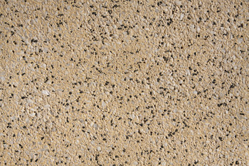 yellow stone with small colored pebbles- image for background.