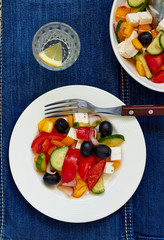 Greek salad with feta cheese, olives and vegetables