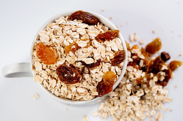 Oatmeal with raisins isolated on a light background