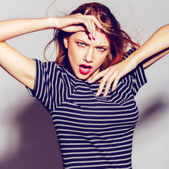 Expressive portrait of a beautiful girl in the studio