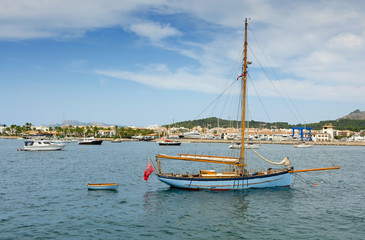 Naklejka na ściany i meble Old sailboat in tropical marina bay