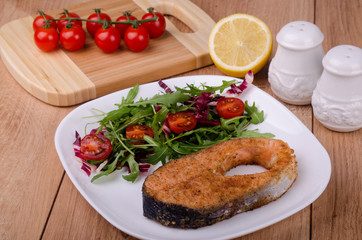 Fried trout with salad